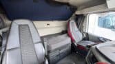 Volvo FH truck cabin with comfortable seats and dashboard.
